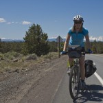 Carly on route with the beautiful mountains surrounding Bend in the background